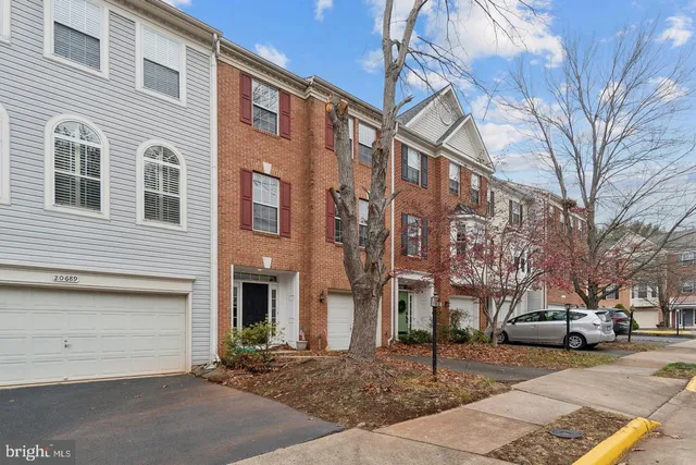 a city street lined with buildings and cars
