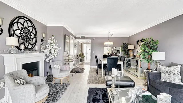 a living room with furniture a fireplace and a table