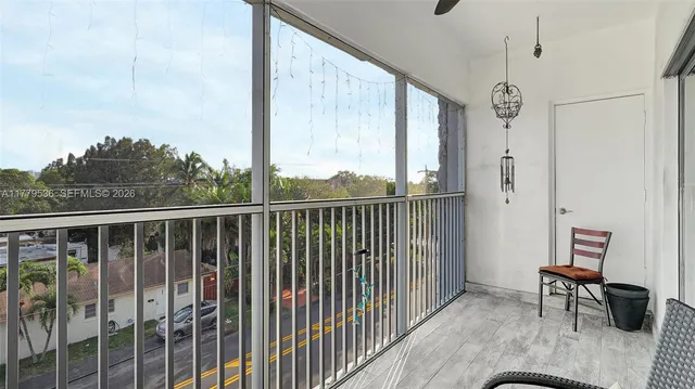 a view of a balcony with furniture