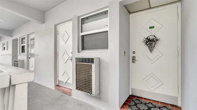 a view of a hallway with paintings on the wall