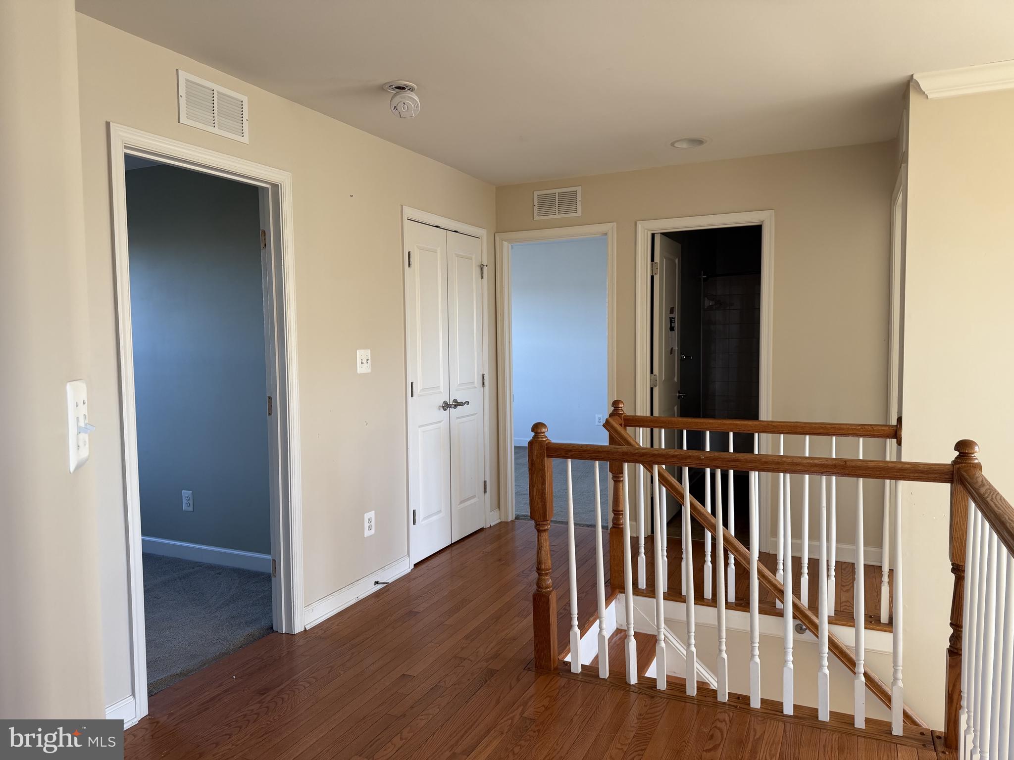 40 Loder Drive Smyrna, DE 19977 - Photo 21 of 29 a view of a hallway with wooden floor and a bathroom