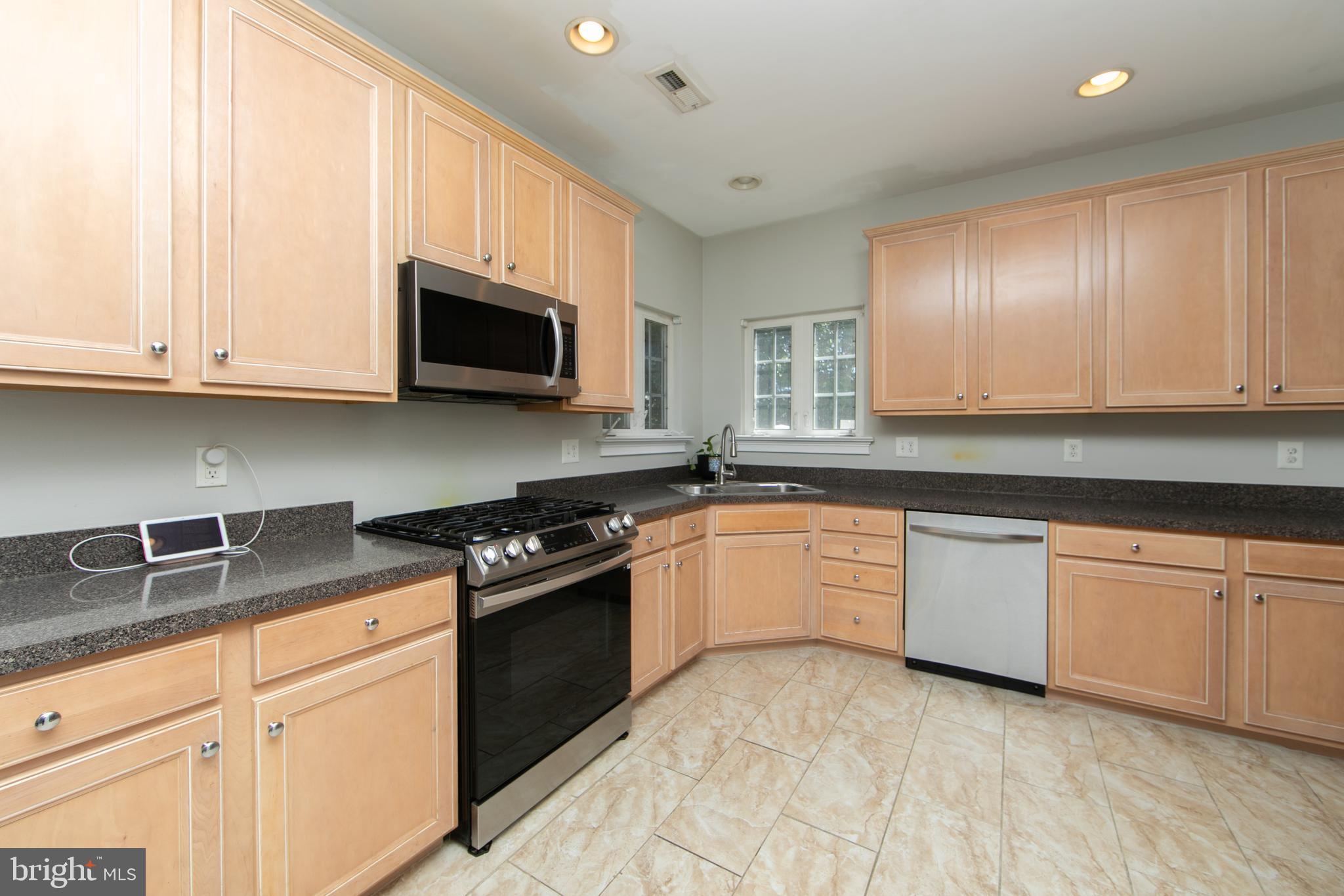 4 Conifer Way Sicklerville, NJ 08081 - Photo 15 of 39 a kitchen with granite countertop cabinets stainless steel appliances and a sink