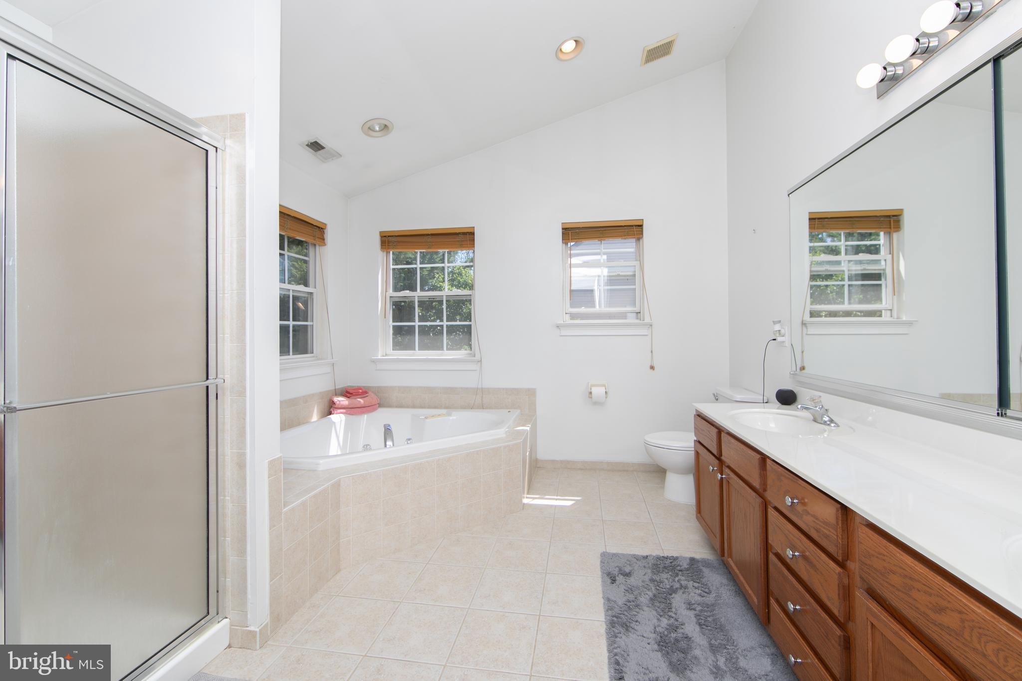 4 Conifer Way Sicklerville, NJ 08081 - Photo 21 of 39 a spacious bathroom with a tub sink and mirror