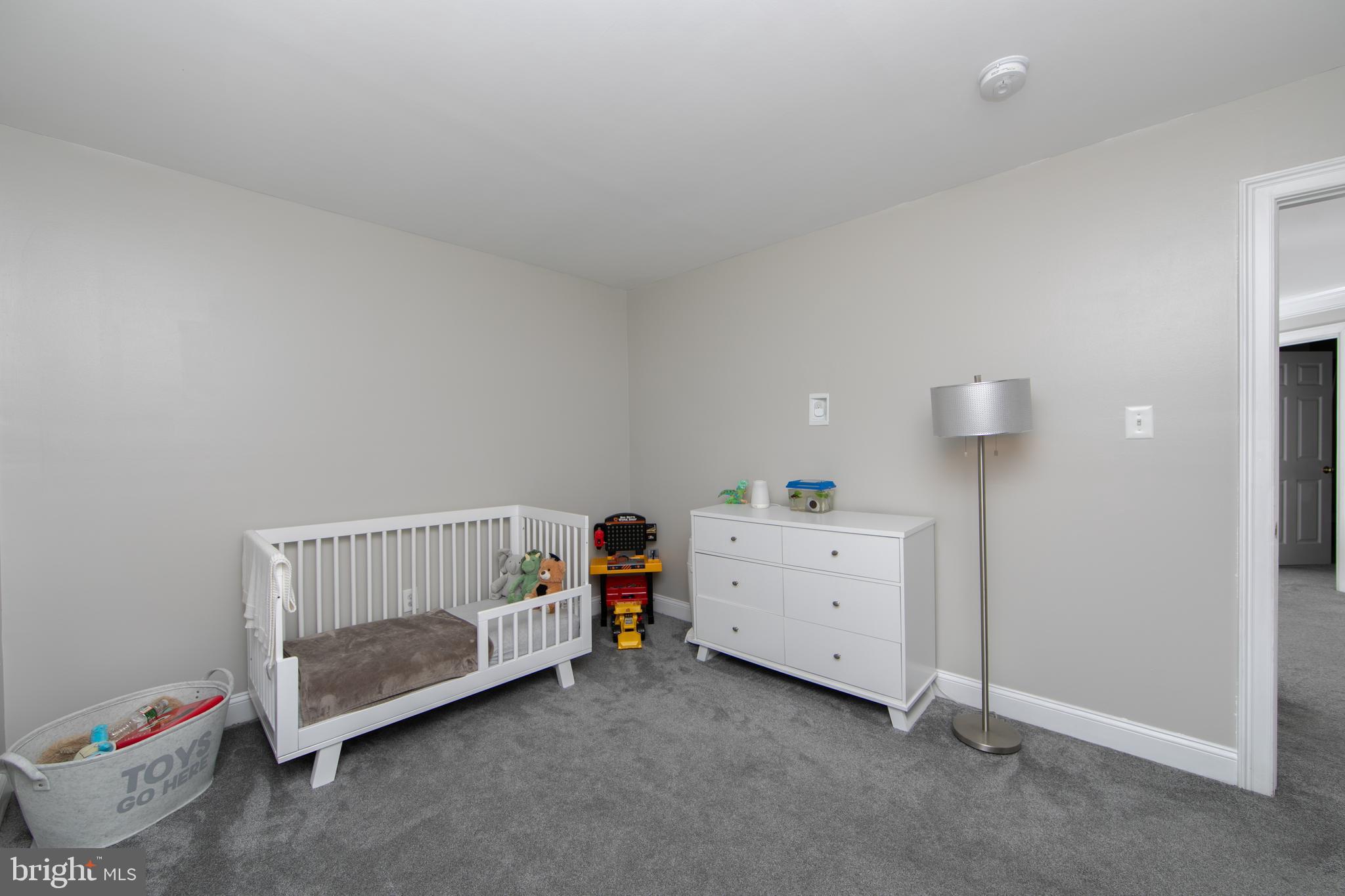 4 Conifer Way Sicklerville, NJ 08081 - Photo 26 of 39 a bedroom with a baby bed and a dresser