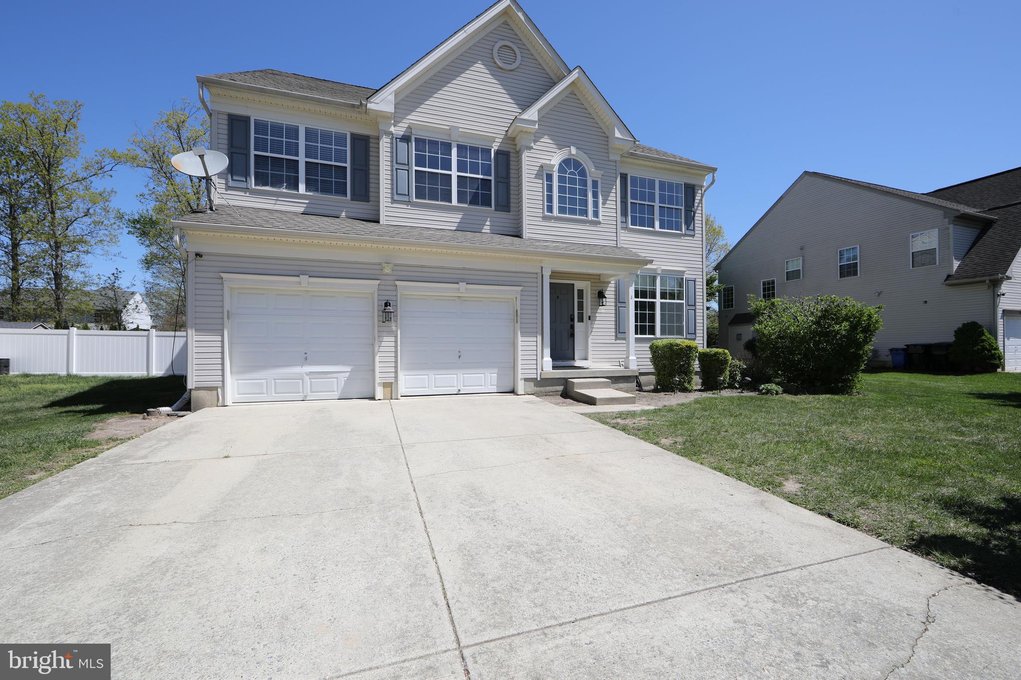 4 Conifer Way Sicklerville, NJ 08081 - Photo 3 of 39 a front view of a house with a yard and garage