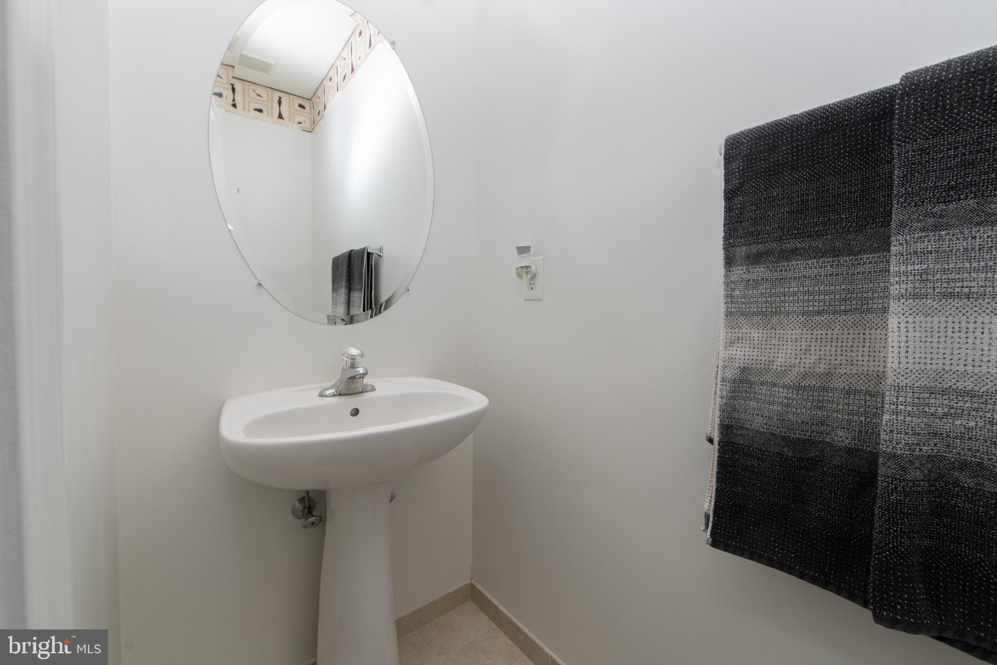 4 Conifer Way Sicklerville, NJ 08081 - Photo 32 of 39 a bathroom with a sink and mirror