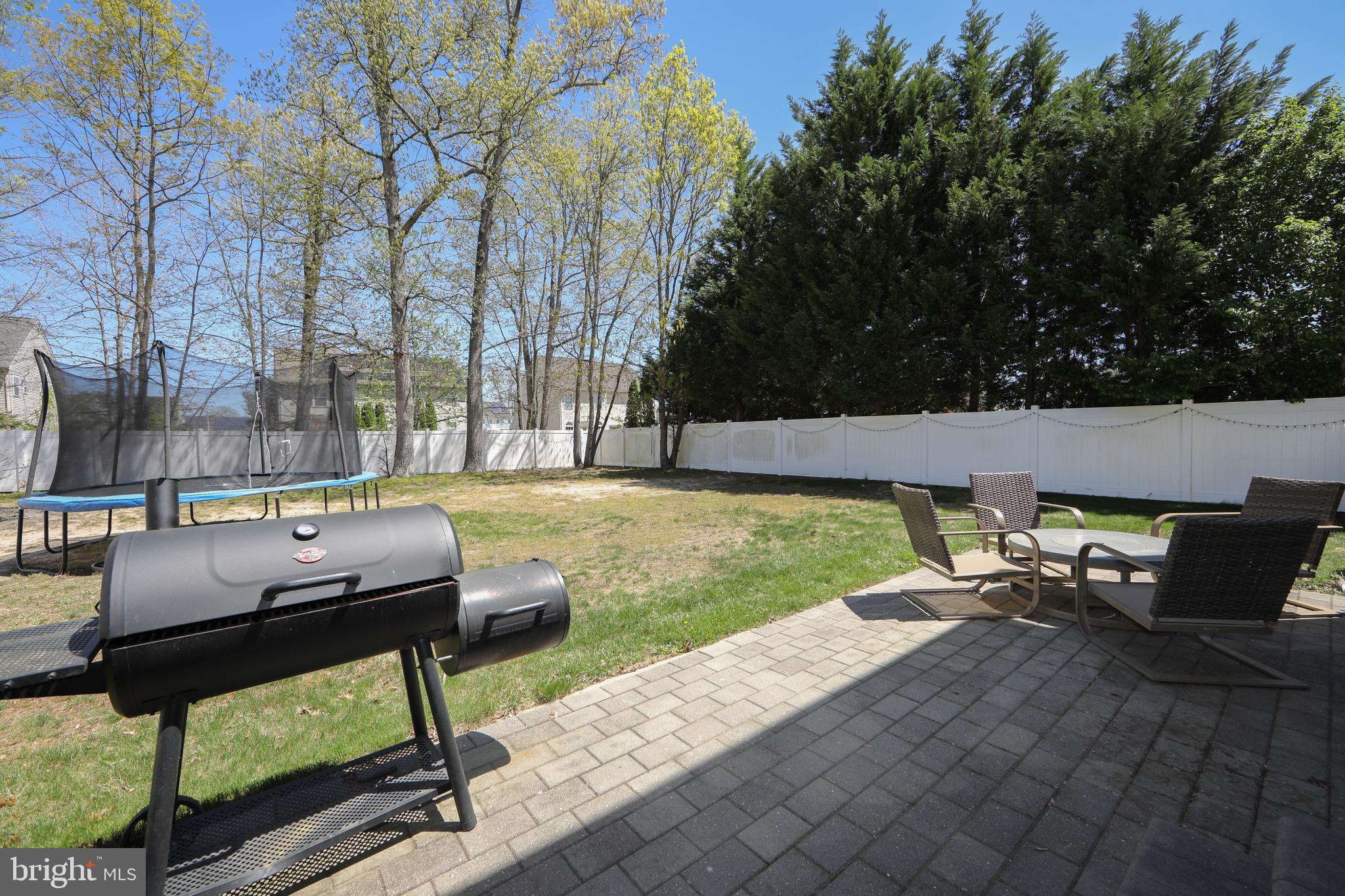4 Conifer Way Sicklerville, NJ 08081 - Photo 37 of 39 a view of backyard with seating area and trees