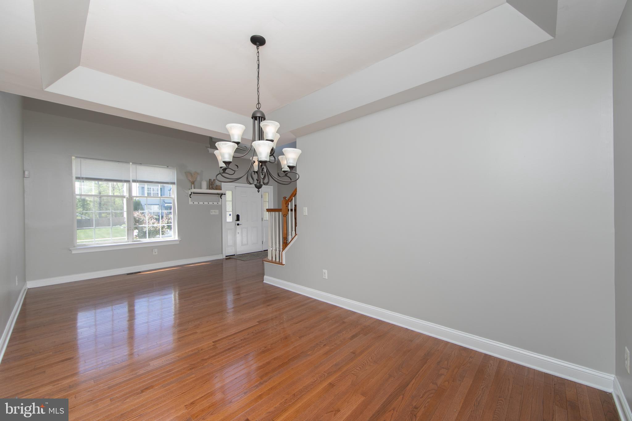 4 Conifer Way Sicklerville, NJ 08081 - Photo 7 of 39 a view of a room with wooden floor chandelier and window