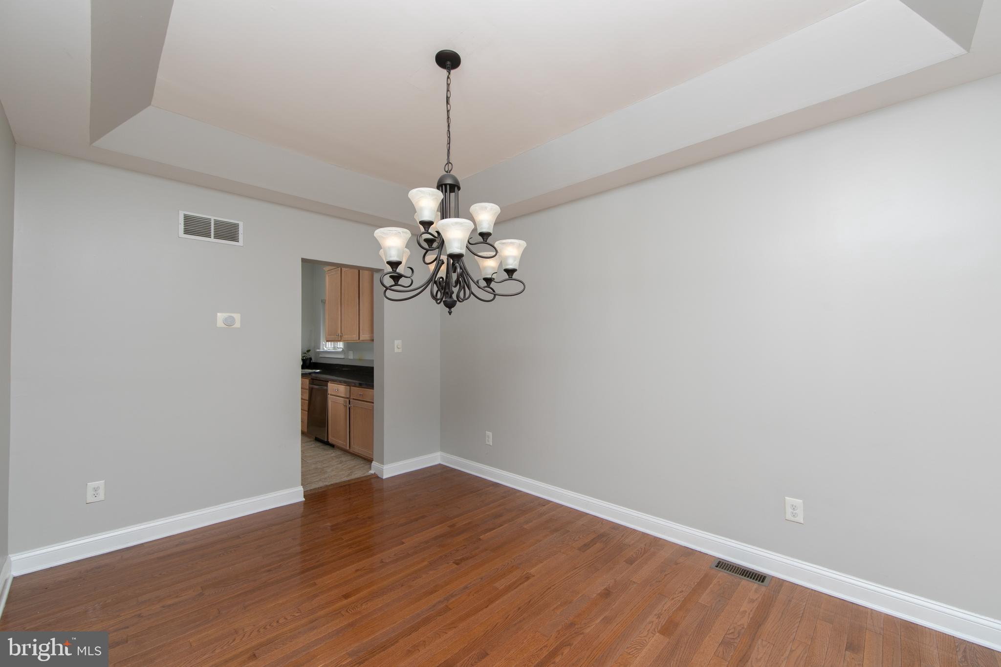 4 Conifer Way Sicklerville, NJ 08081 - Photo 8 of 39 a view of a room with a chandelier fan and wooden floor
