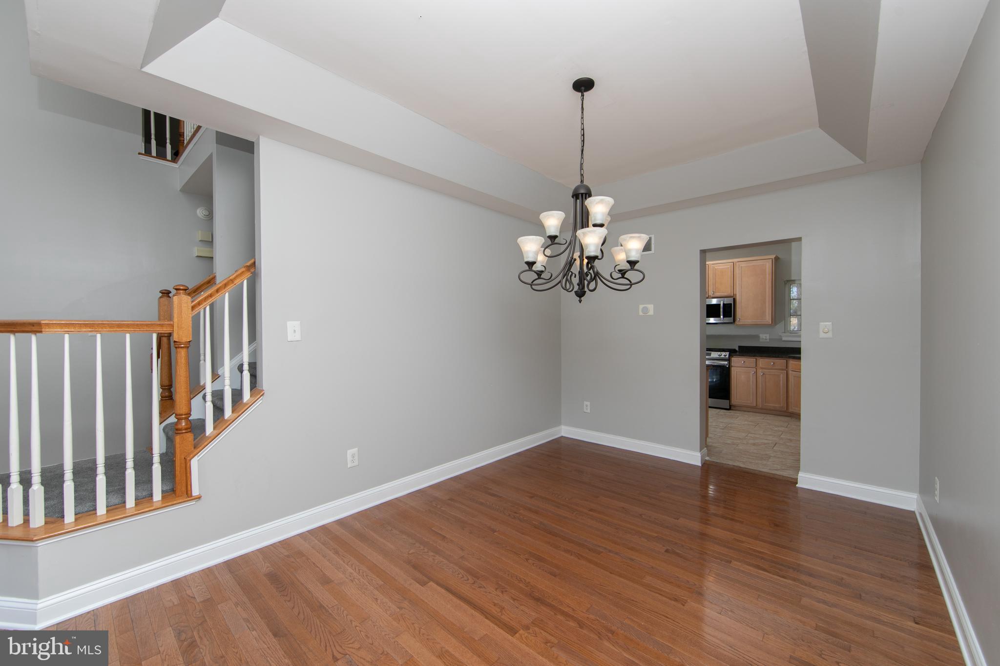 4 Conifer Way Sicklerville, NJ 08081 - Photo 9 of 39 a view of a room with wooden floor and chandelier