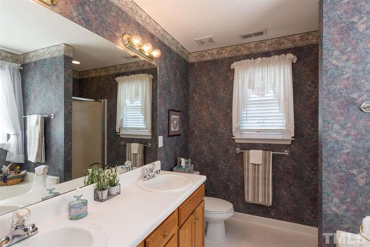 4401 Riverport Road Raleigh, NC 27616 - Photo 11 of 22 Master bathroom with garden tub, separate shower and dual vanity. Window over the tub fills the room with sunshine!
