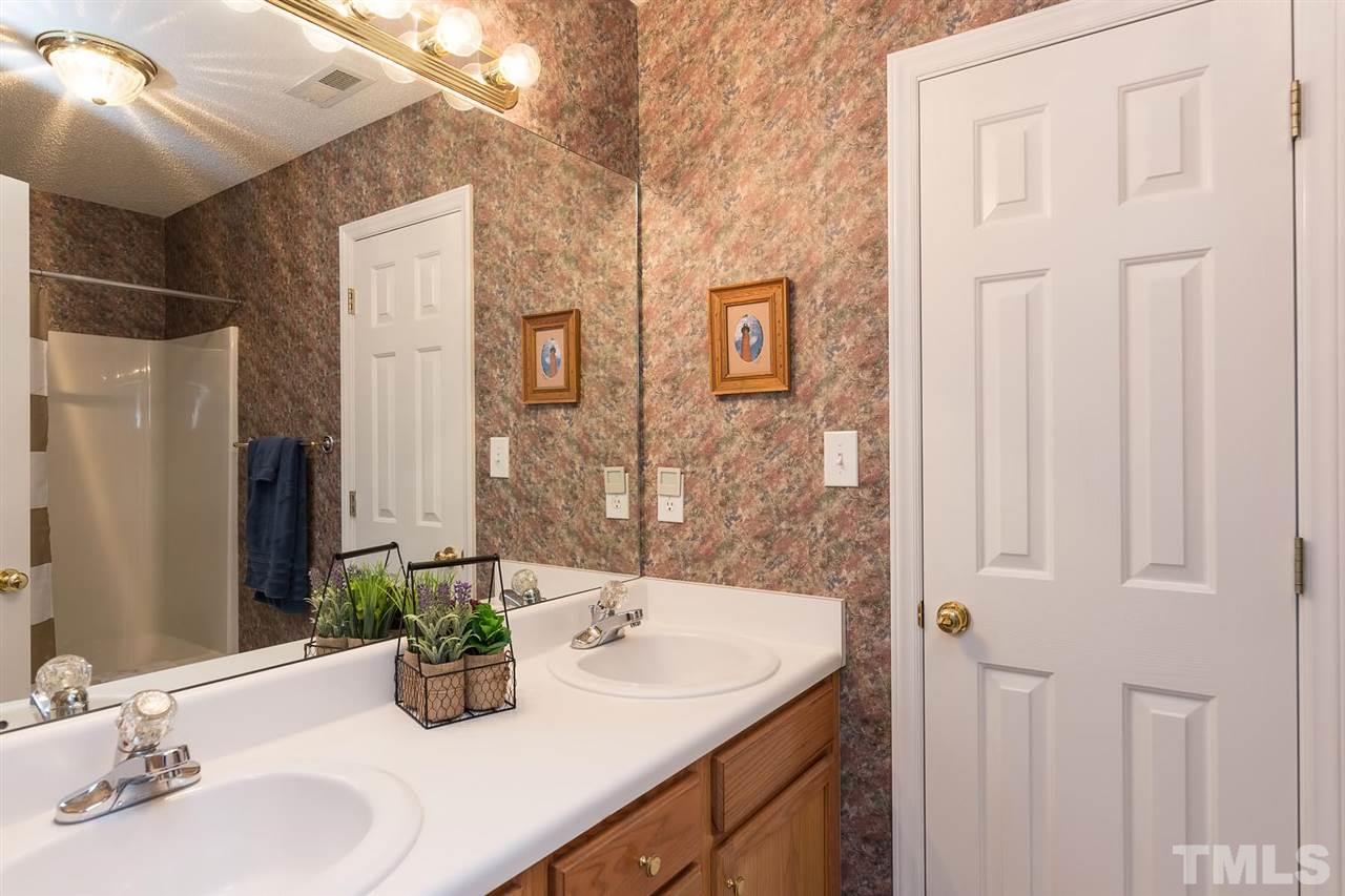4401 Riverport Road Raleigh, NC 27616 - Photo 14 of 22 Hall bathroom can be accessed from the hallway or the bedroom it is connected to.