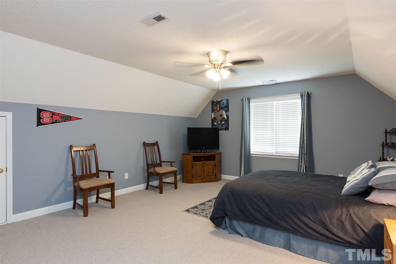 4401 Riverport Road Raleigh, NC 27616 - Photo 16 of 22 Room can be used for either a bonus or very large bedroom. Nice size closet and access to attic storage on each side of the room.