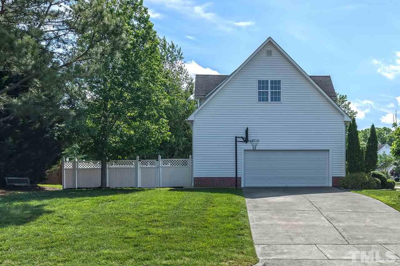 4401 Riverport Road Raleigh, NC 27616 - Photo 22 of 22 Side load garage on a corner lot is an upgrade!. You can fit many vehicles in the driveway.