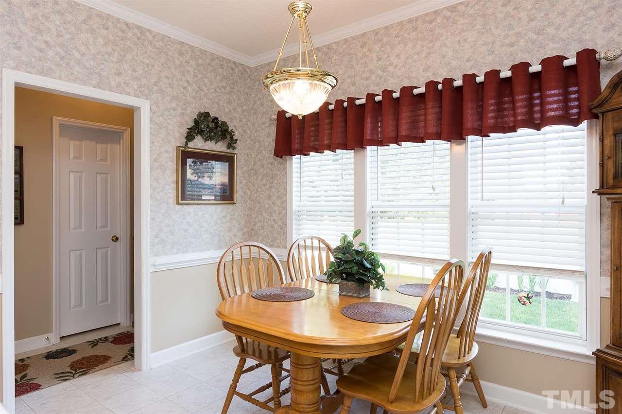 Large windows let in plenty of natural light. Lovely view of the back yard and all the beautiful plantings.