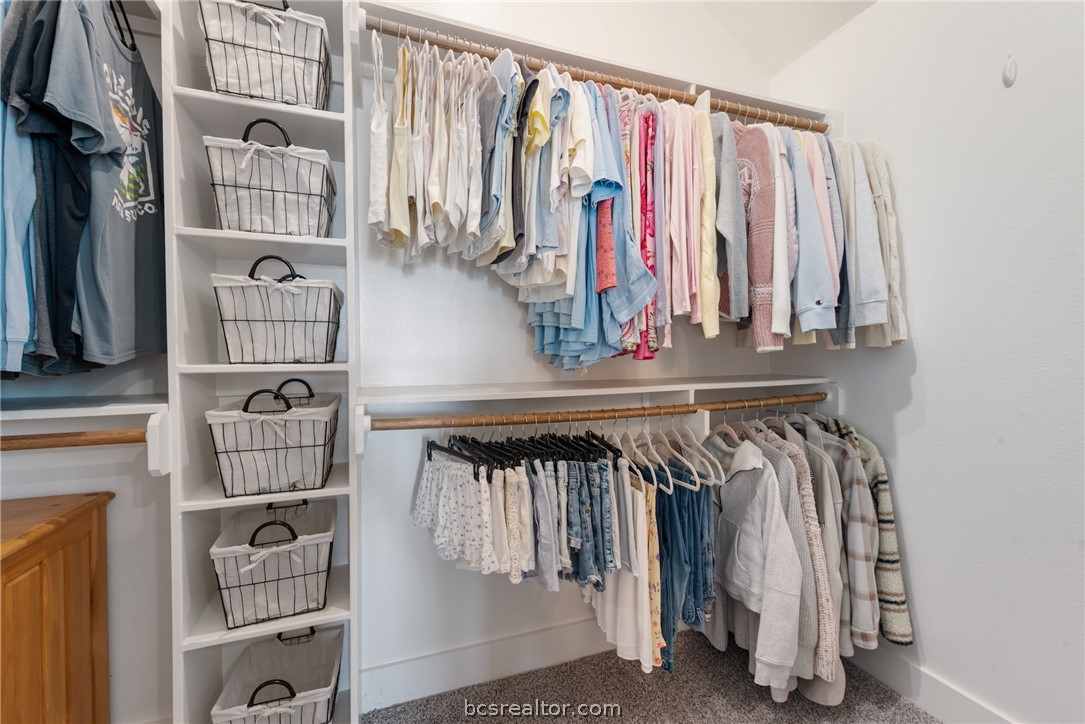 244 Brazos Bend Snook, TX 77879 - Photo 20 of 33 a view of walk in closet with clothes and shoes