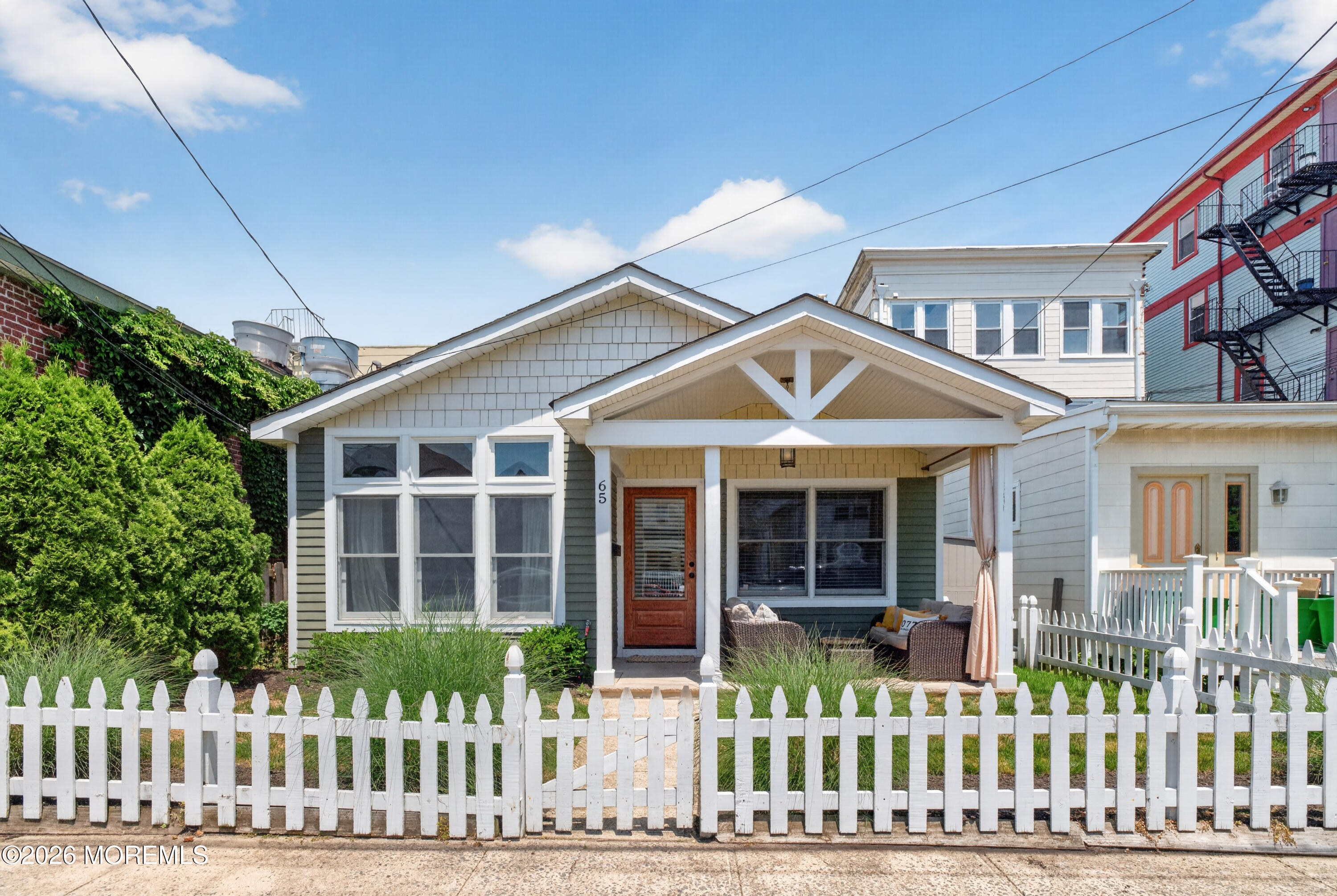 65 Heck Avenue Ocean Grove, NJ 07756 - Photo 1 of 37 a front view of a house with a porch