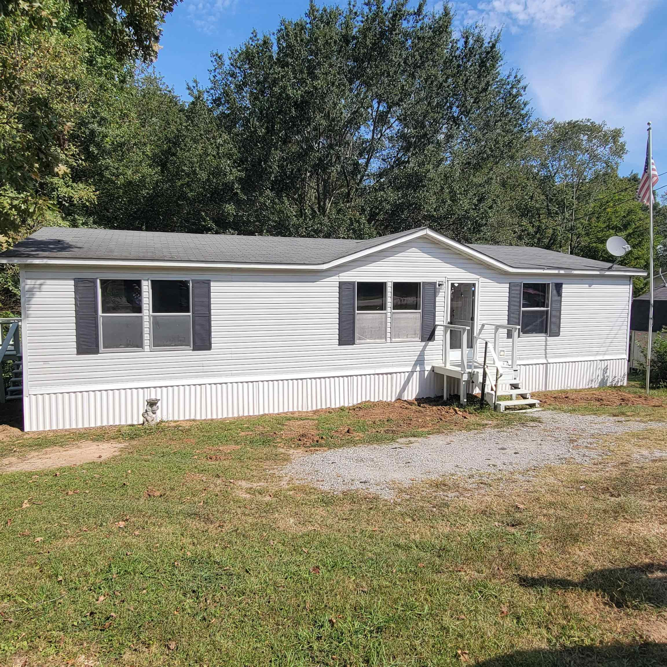 2012 Finger Leapwood Road Finger, TN 38334 - Photo 1 of 12 a front view of a house with garden