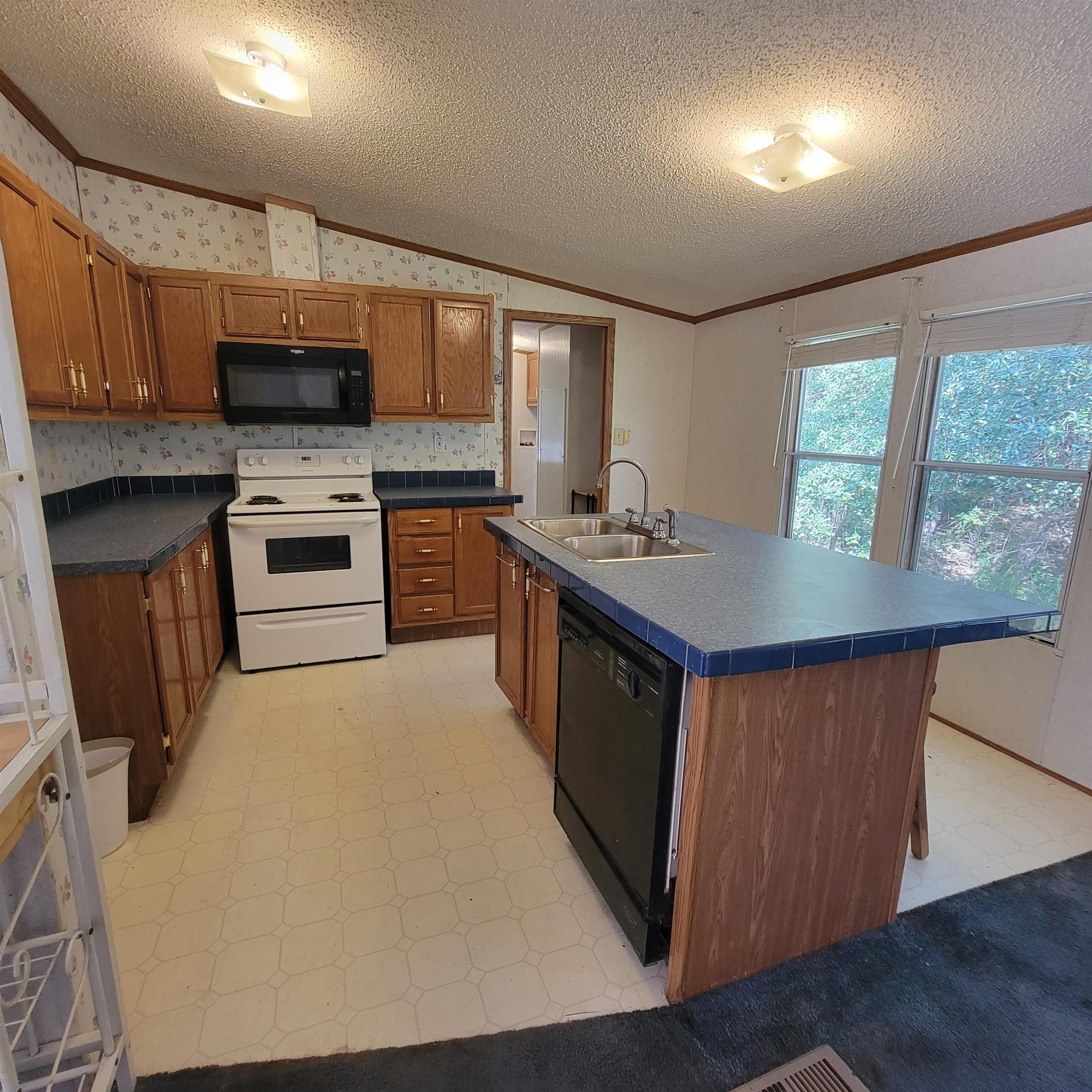 2012 Finger Leapwood Road Finger, TN 38334 - Photo 2 of 12 a kitchen with a stove a sink and a refrigerator