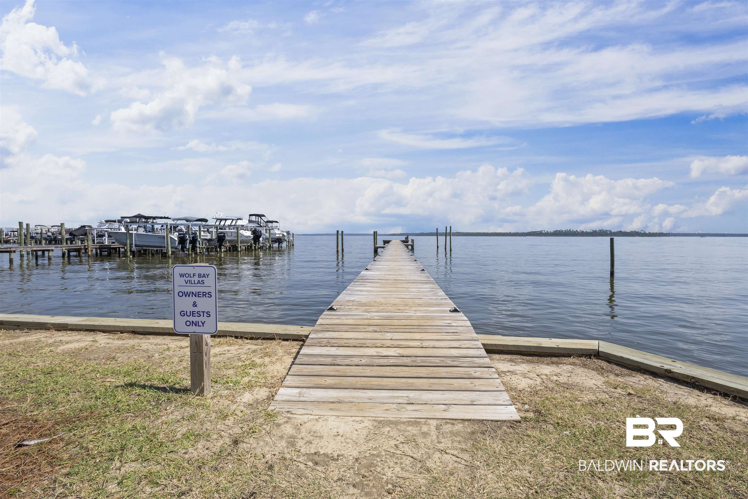 25925 Canal Road, Unit 207 Orange Beach, AL 36561 - Photo 33 of 42 View of dock featuring a water view