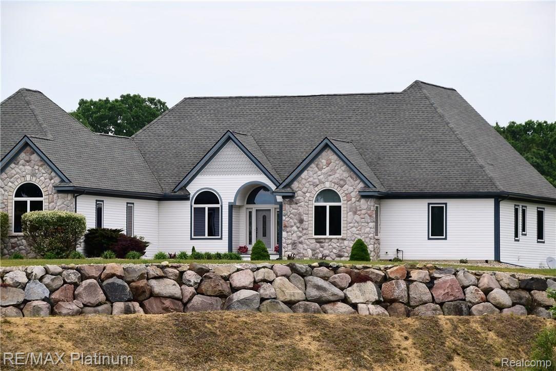 270 North Kane Road Webberville, MI 48892 - Photo 1 of 51 Low Maintenance exterior with vinyl siding and stone.