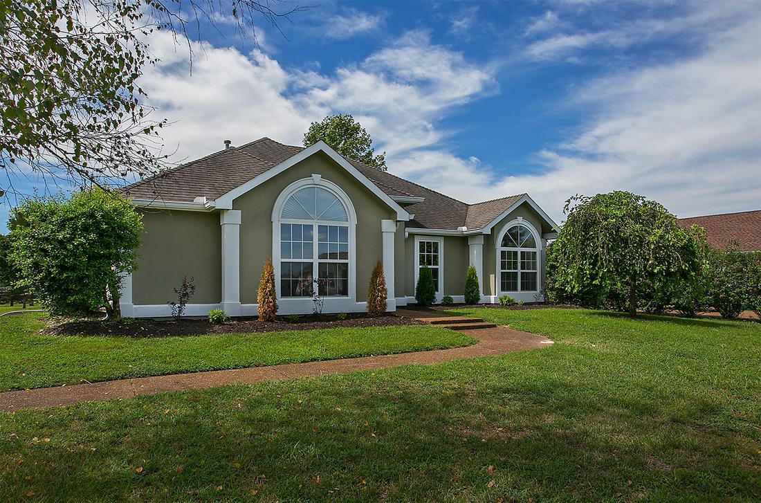 1228 Hunters Point Lane Spring Hill, TN 37174 - Photo 1 of 23 a front view of a house with a yard