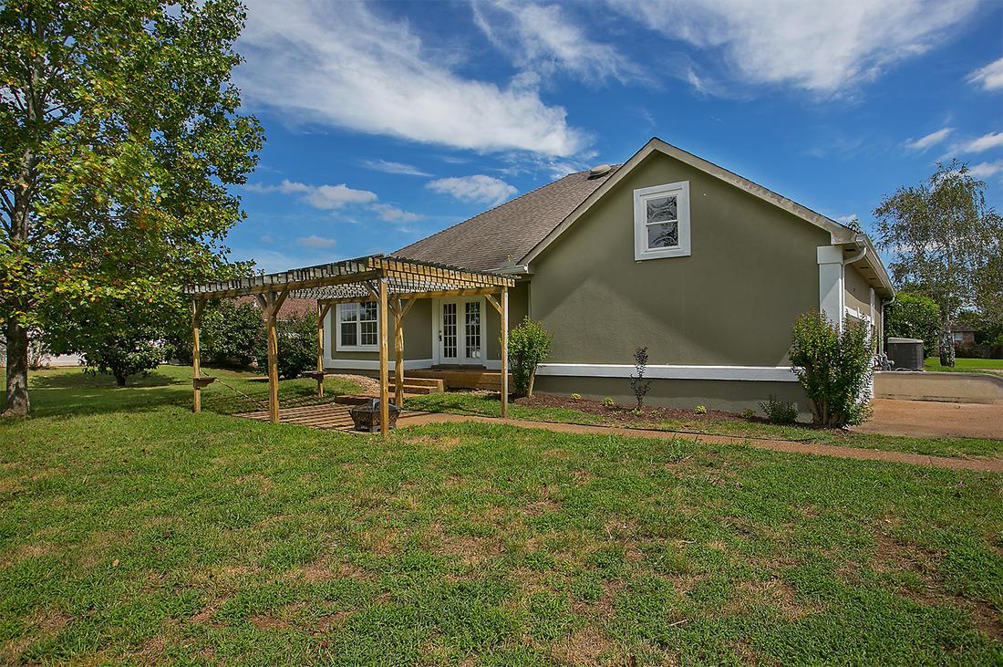 1228 Hunters Point Lane Spring Hill, TN 37174 - Photo 22 of 23 a view of a house with a yard