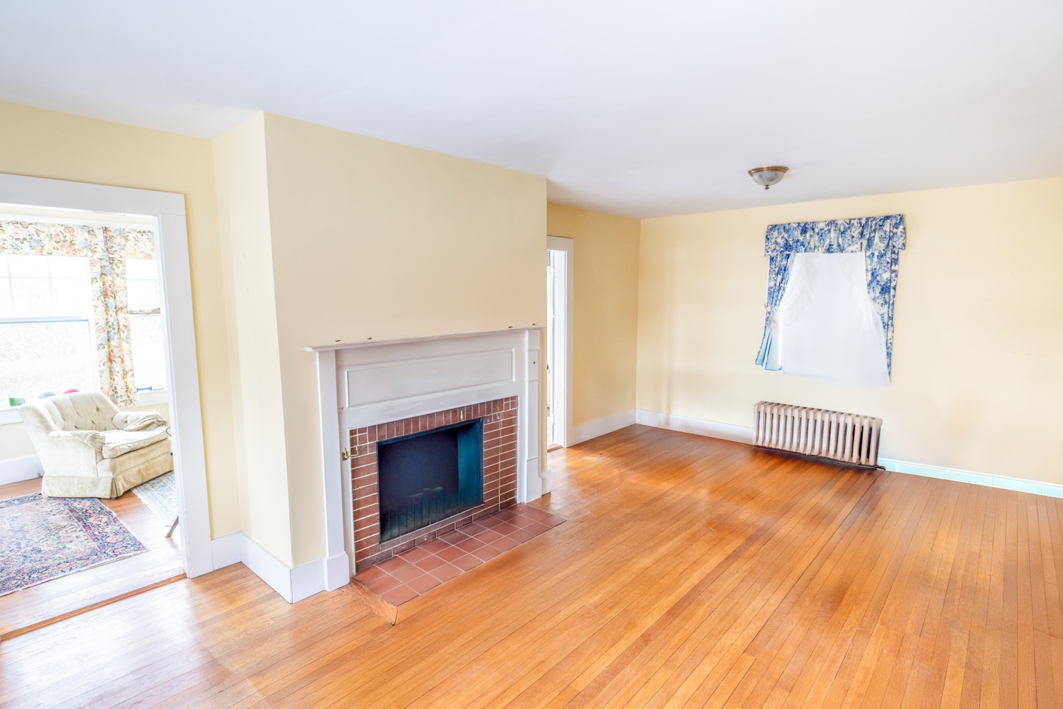 35 West Chester Street Nantucket, MA 02554 - Photo 6 of 14 a view of a livingroom with wooden floor and a fireplace