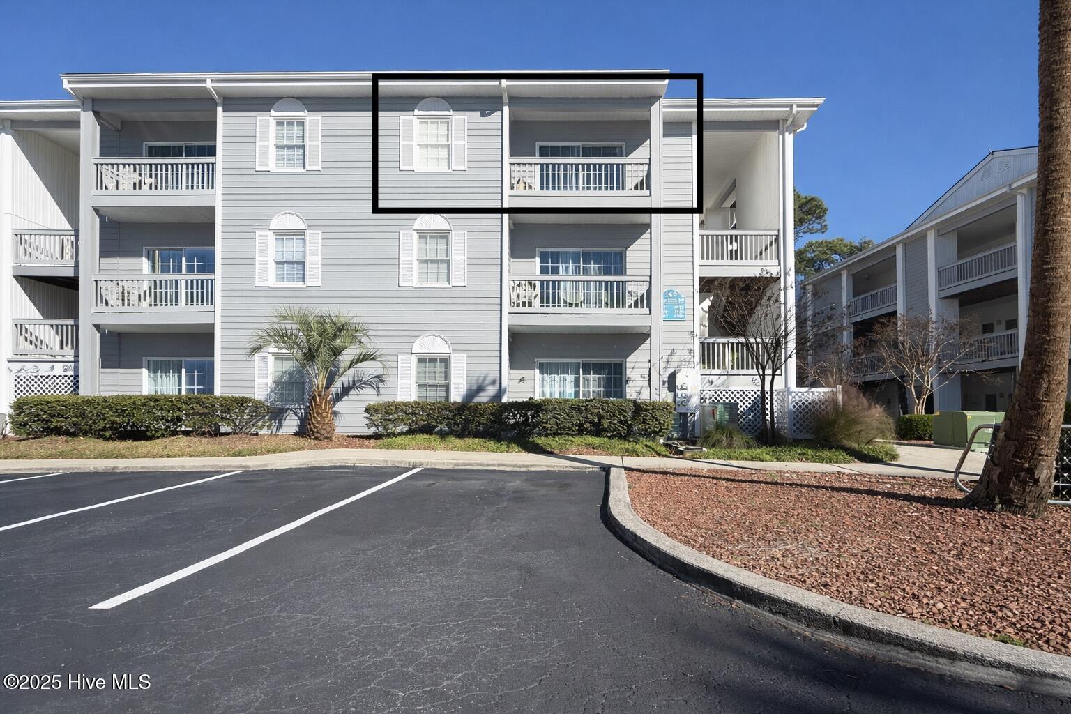165 Royal Poste Road, Unit 2911 Sunset Beach, NC 28468 - Photo 2 of 24 Unit #2911 is a top floor unit featuring a balcony that overlooks the amenity area.