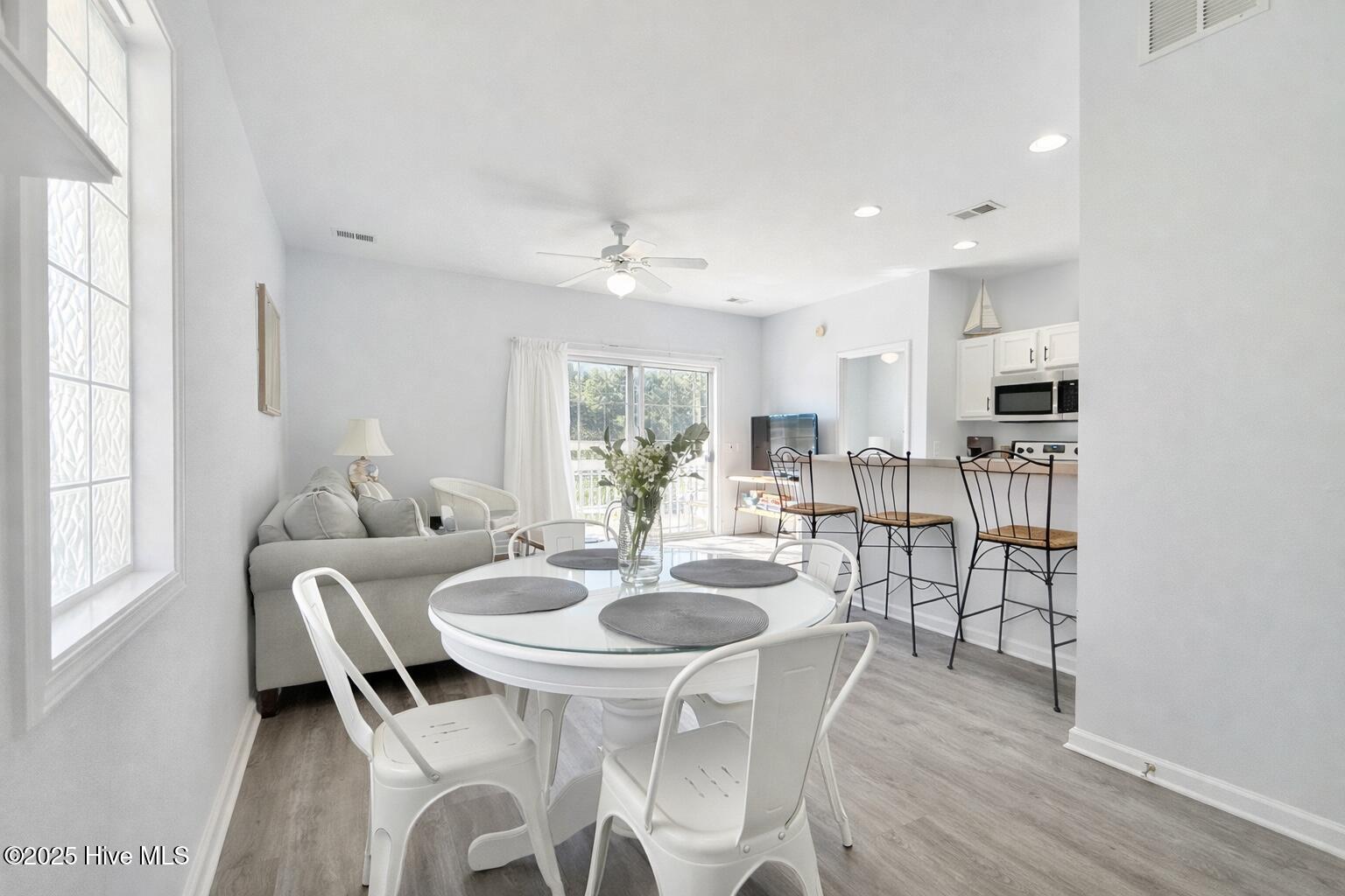 165 Royal Poste Road, Unit 2911 Sunset Beach, NC 28468 - Photo 3 of 24 Dining area with open flow to kitchen and living space, perfect for everyday meals or entertaining.