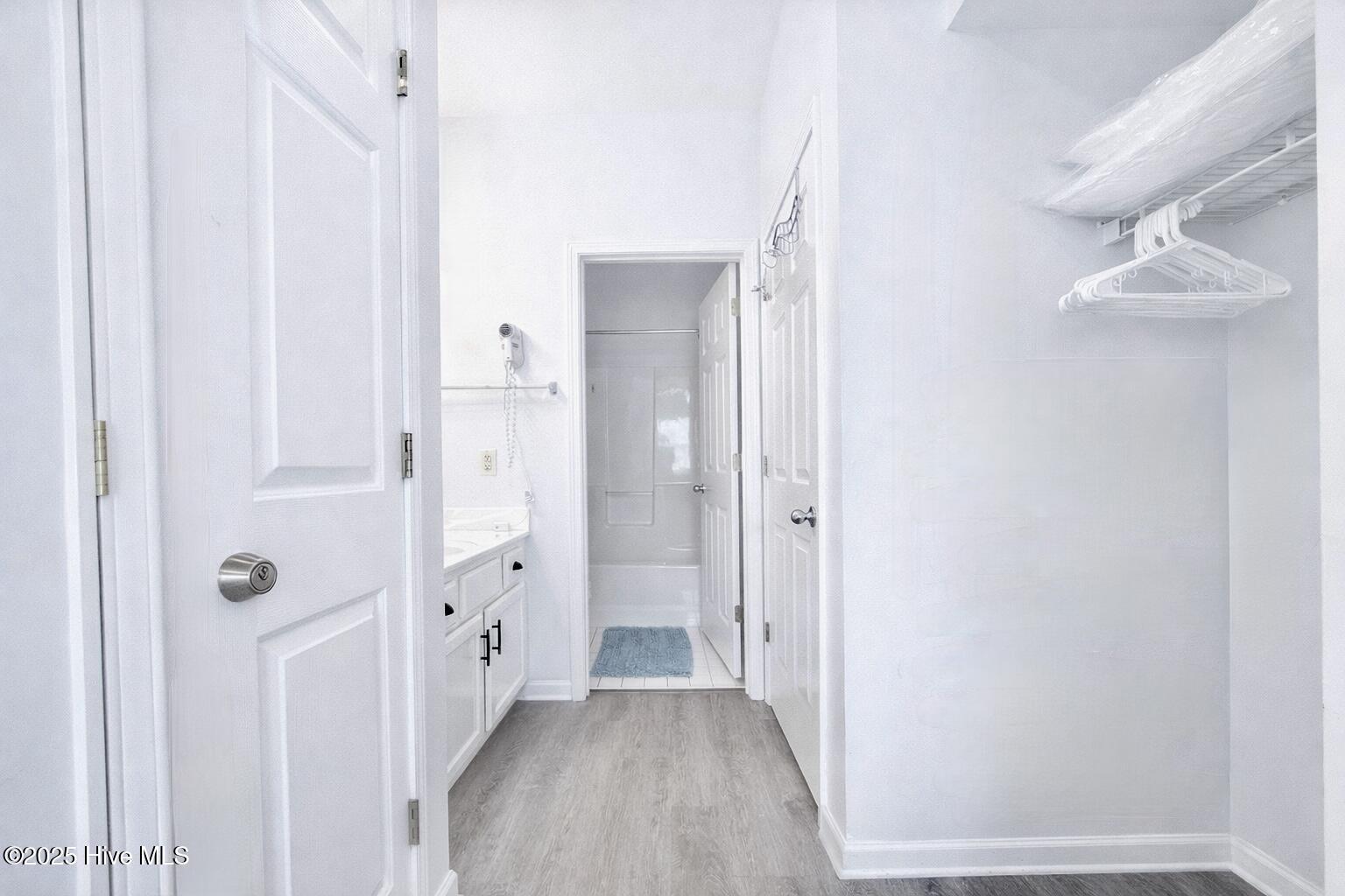 165 Royal Poste Road, Unit 2911 Sunset Beach, NC 28468 - Photo 9 of 24 Clean, well-maintained bathroom with full tub/shower combo, vanity storage, and bright lighting. Storage area is included, too.