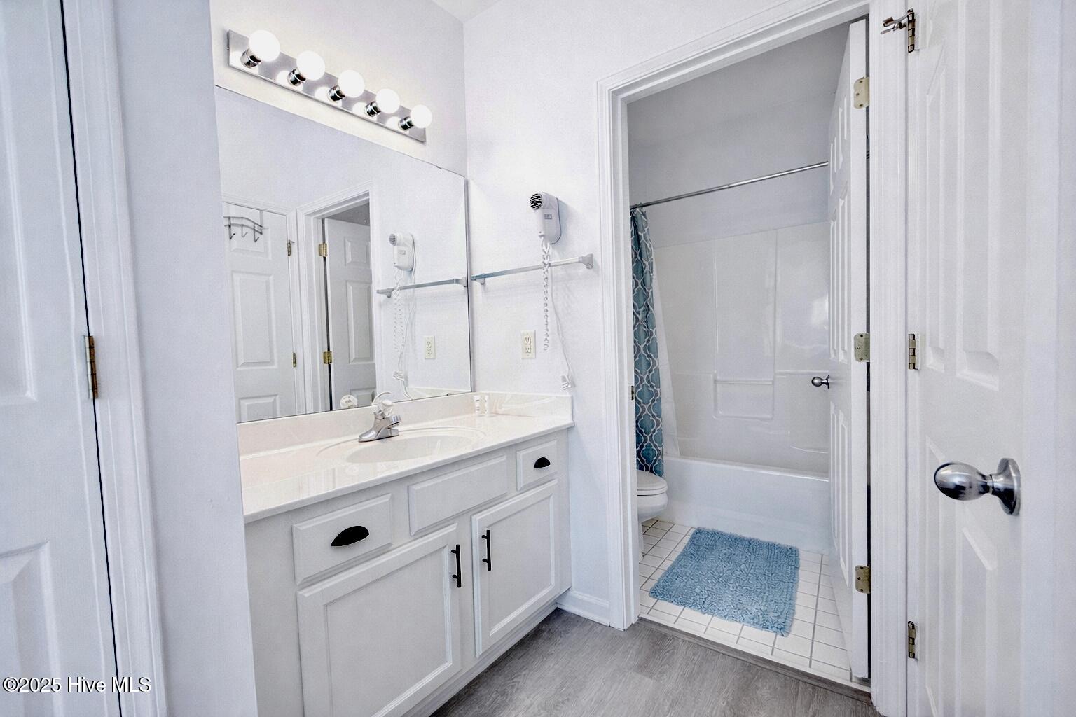 165 Royal Poste Road, Unit 2911 Sunset Beach, NC 28468 - Photo 10 of 24 Clean, well-maintained bathroom with full tub/shower combo, vanity storage, and bright lighting