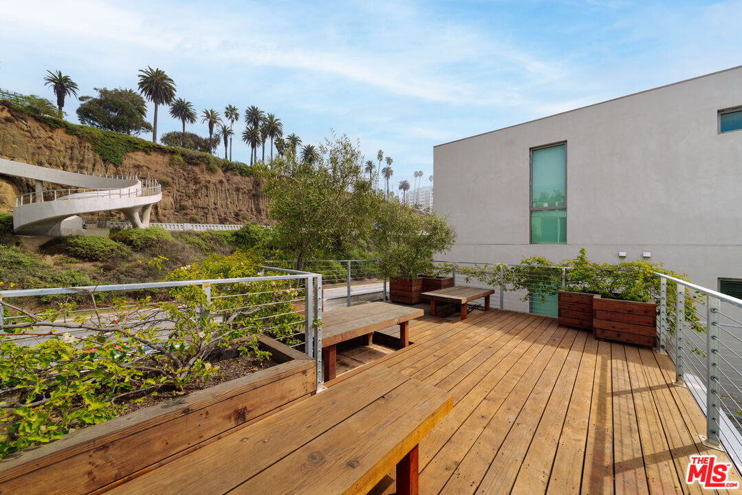 936 Palisades Beach Road Santa Monica, CA 90403 - Photo 20 of 31 a view of a chairs and table on the wooden floor