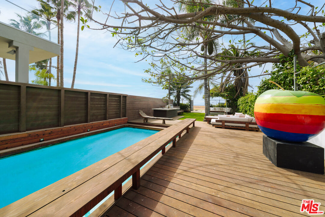 936 Palisades Beach Road Santa Monica, CA 90403 - Photo 23 of 31 a view of a swimming pool with a lounge chairs