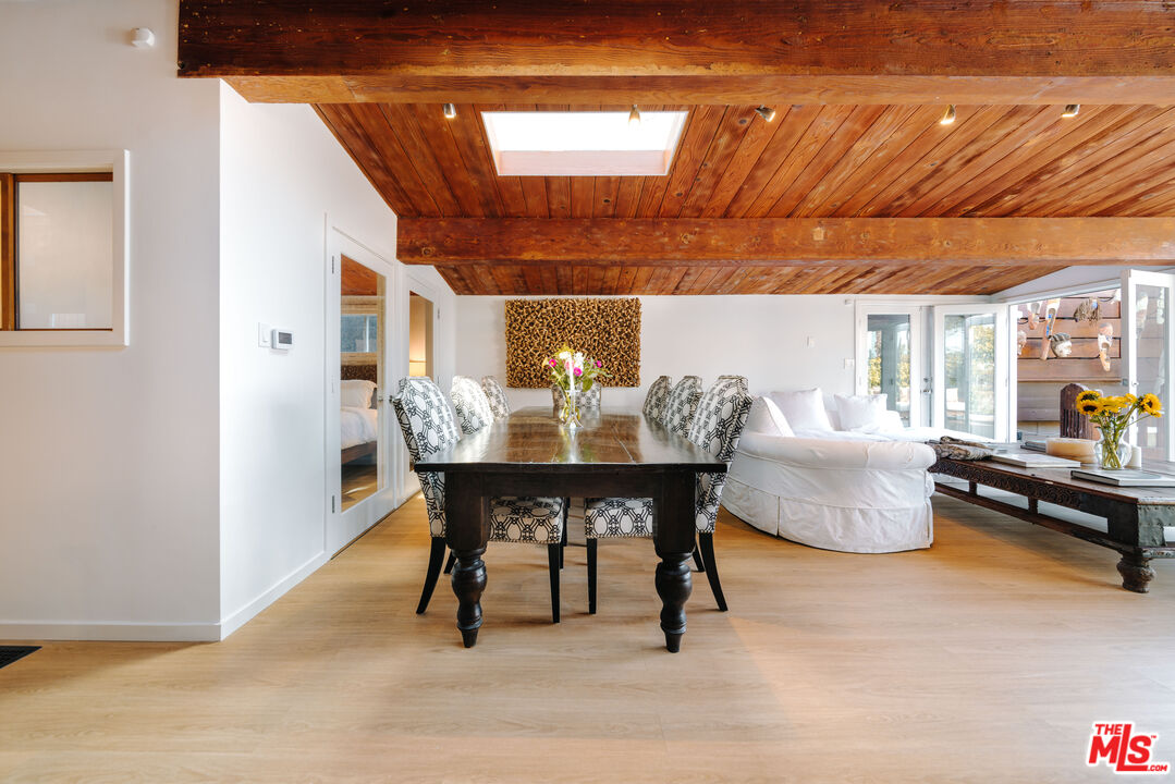 936 Palisades Beach Road Santa Monica, CA 90403 - Photo 4 of 31 a view of a dining room with furniture