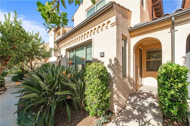 a front view of a house with a plant