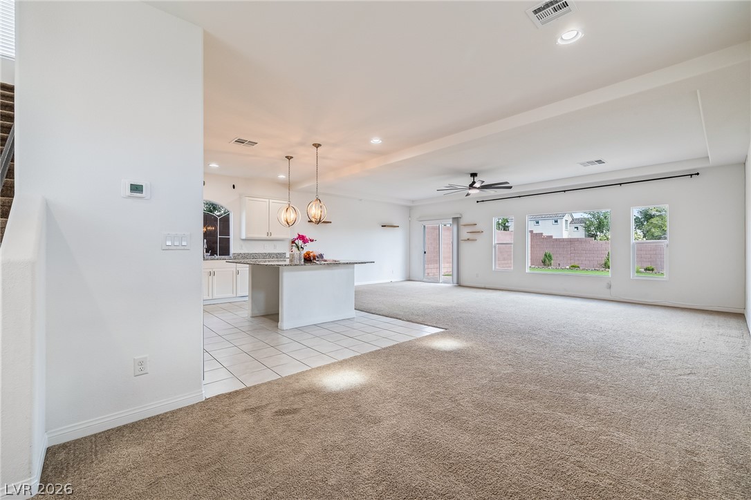 5510 Ripple Ridge Avenue Las Vegas, NV 89139 - Photo 21 of 45 This expansive open-concept living area seamlessly connects the kitchen and living room.