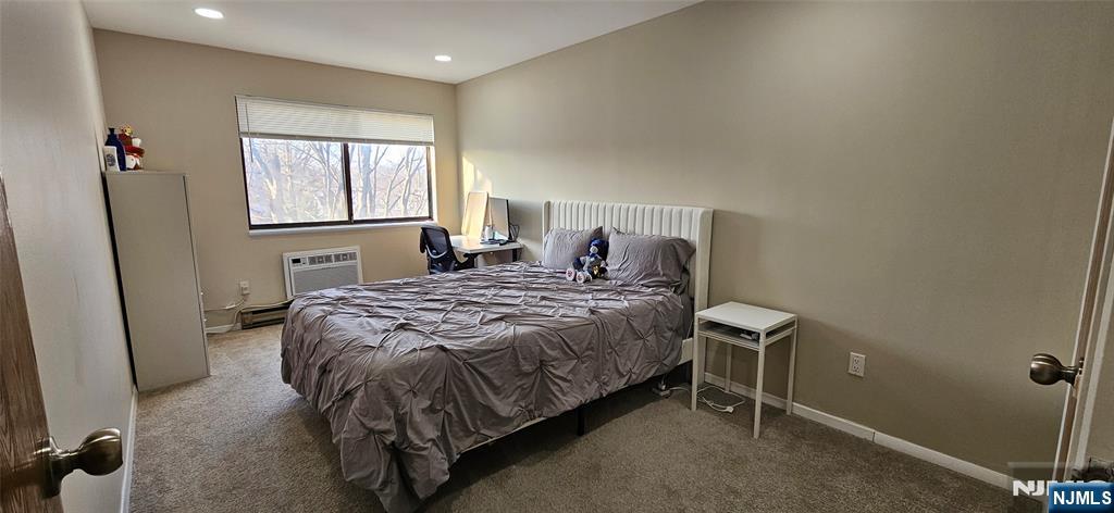 50 Euclid Avenue, Unit 3B Hackensack, NJ 07601 - Photo 16 of 16 a bed sitting in a room next to a window