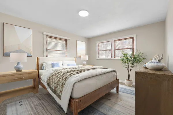 a bedroom with a bed and window
