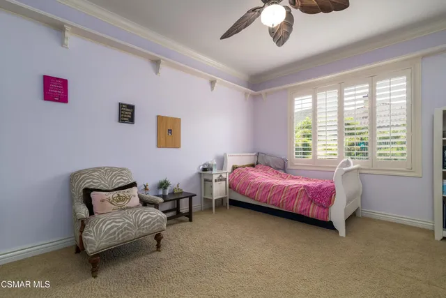 a bedroom with bed and a window