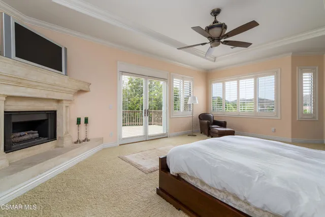 a spacious bedroom with a large bed and a window