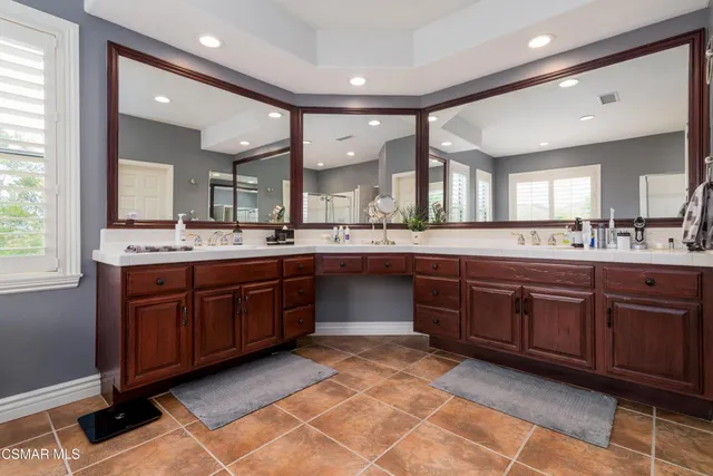 a large kitchen with a large counter space and sink