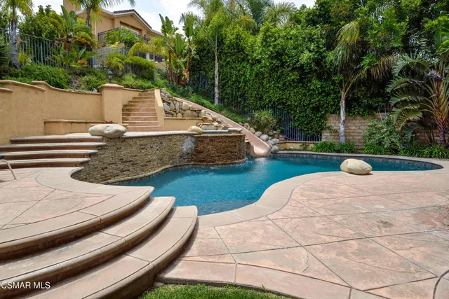 a view of a yard with chairs