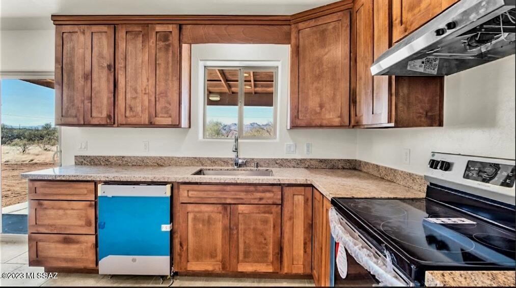 1850 Isabel Court Rio Rico, AZ 85648 - Photo 7 of 7 a kitchen with a sink cabinets and wooden floor
