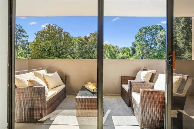 a view of balcony with furniture