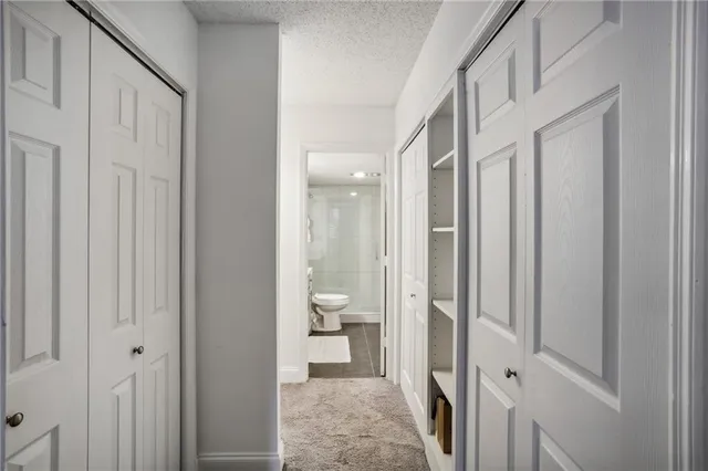 a bathroom with a glass door shower