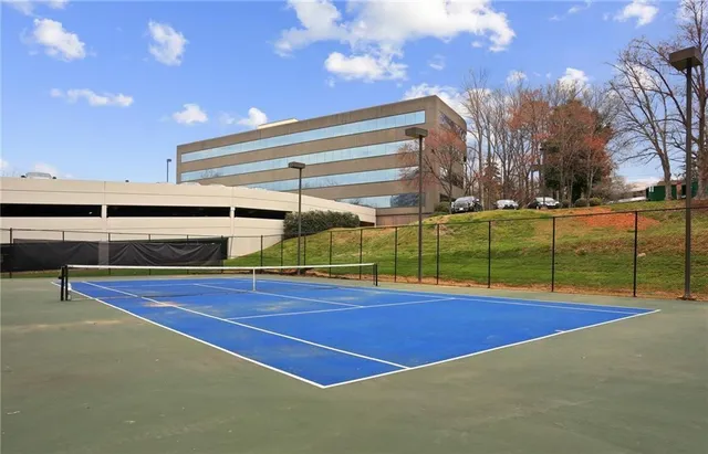 a view of an outdoor space and tennis court