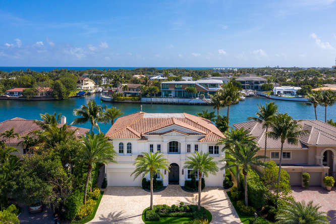 620 Golden Harbour Drive Boca Raton, FL 33432 - Photo 2 of 45 an aerial view of a house with a lake view