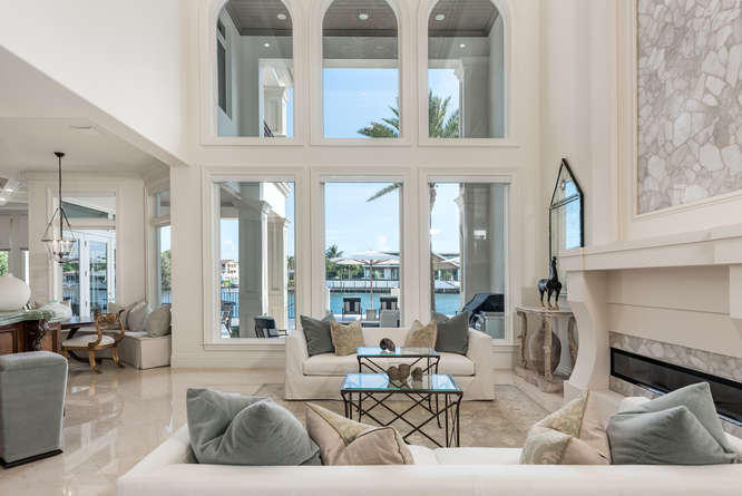 620 Golden Harbour Drive Boca Raton, FL 33432 - Photo 14 of 45 a living room with furniture and large windows