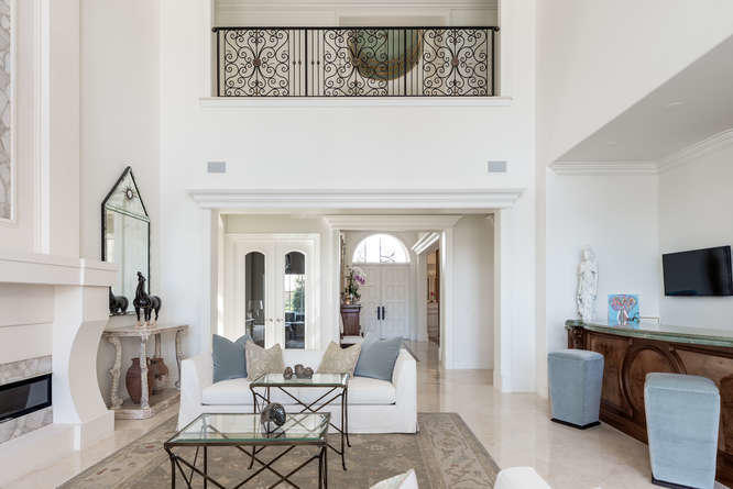 620 Golden Harbour Drive Boca Raton, FL 33432 - Photo 17 of 45 a living room with furniture a fireplace and a flat screen tv